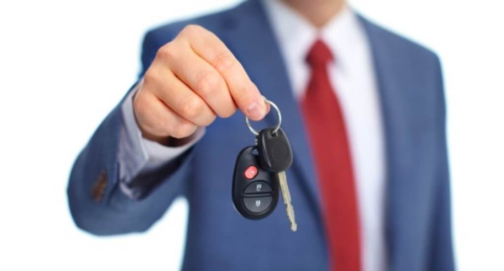 Man Holding Car Keys